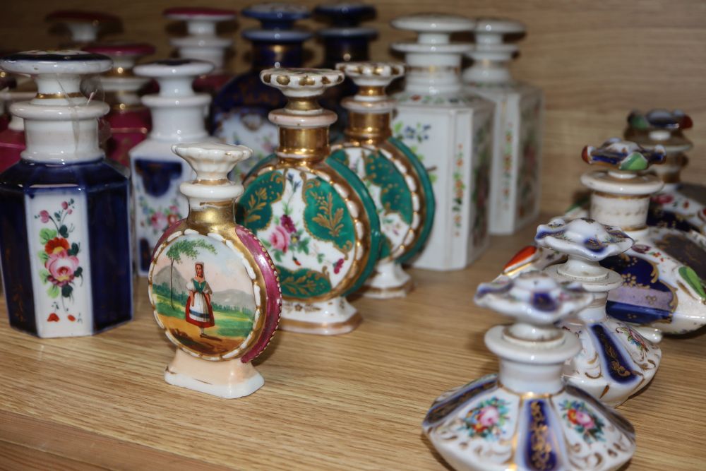 A collection of French porcelain scent bottles and a teapot (24)